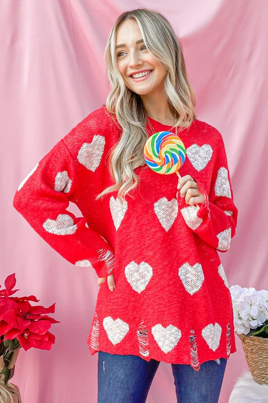 ❤️ Red Distressed Sweater with White Hearts: Sweet with a Touch of Edge! ✨